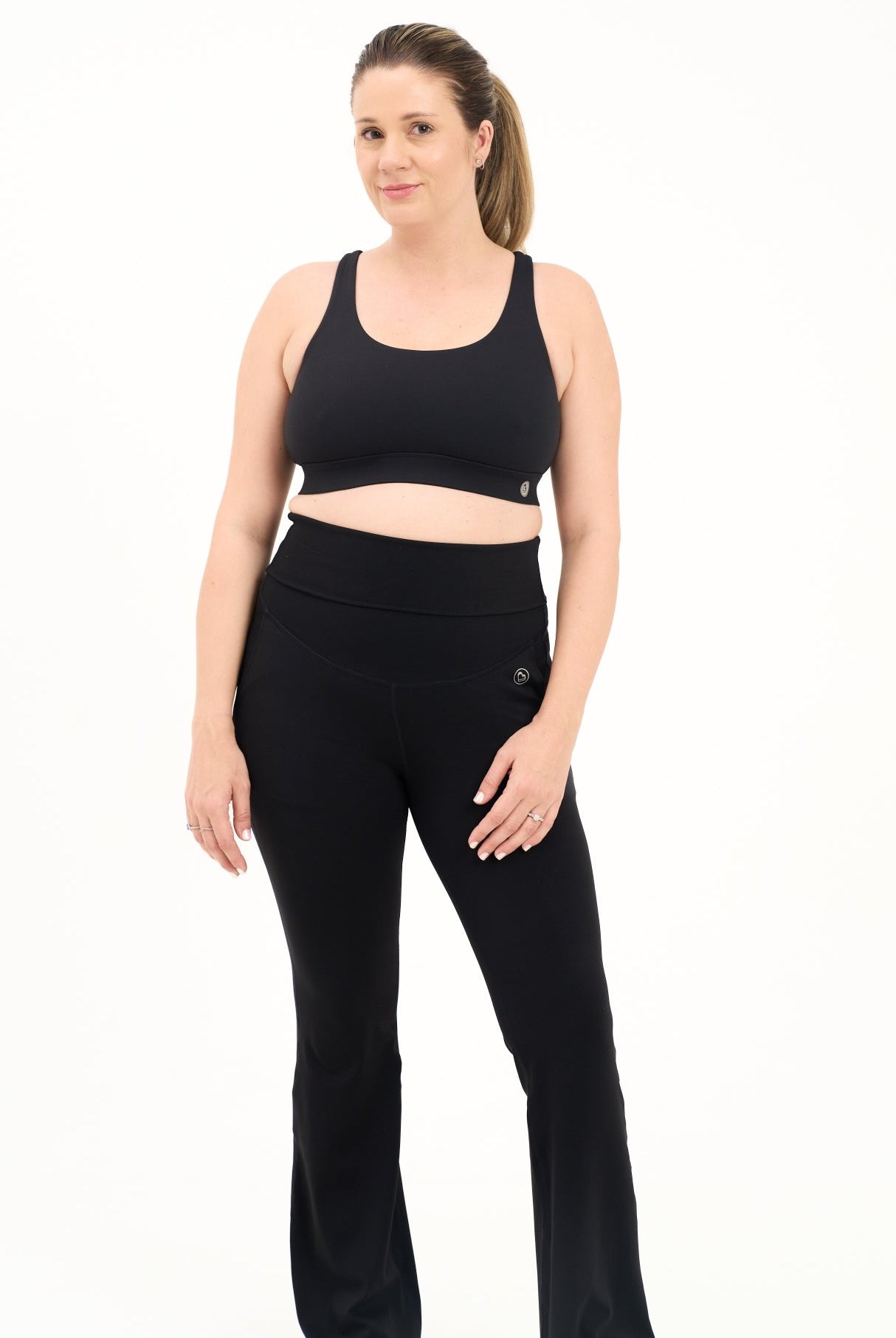 Mum wearing flared maternity leggings in black