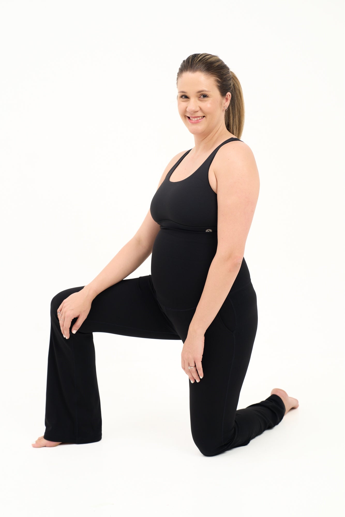 Mum wearing flared maternity leggings in black
