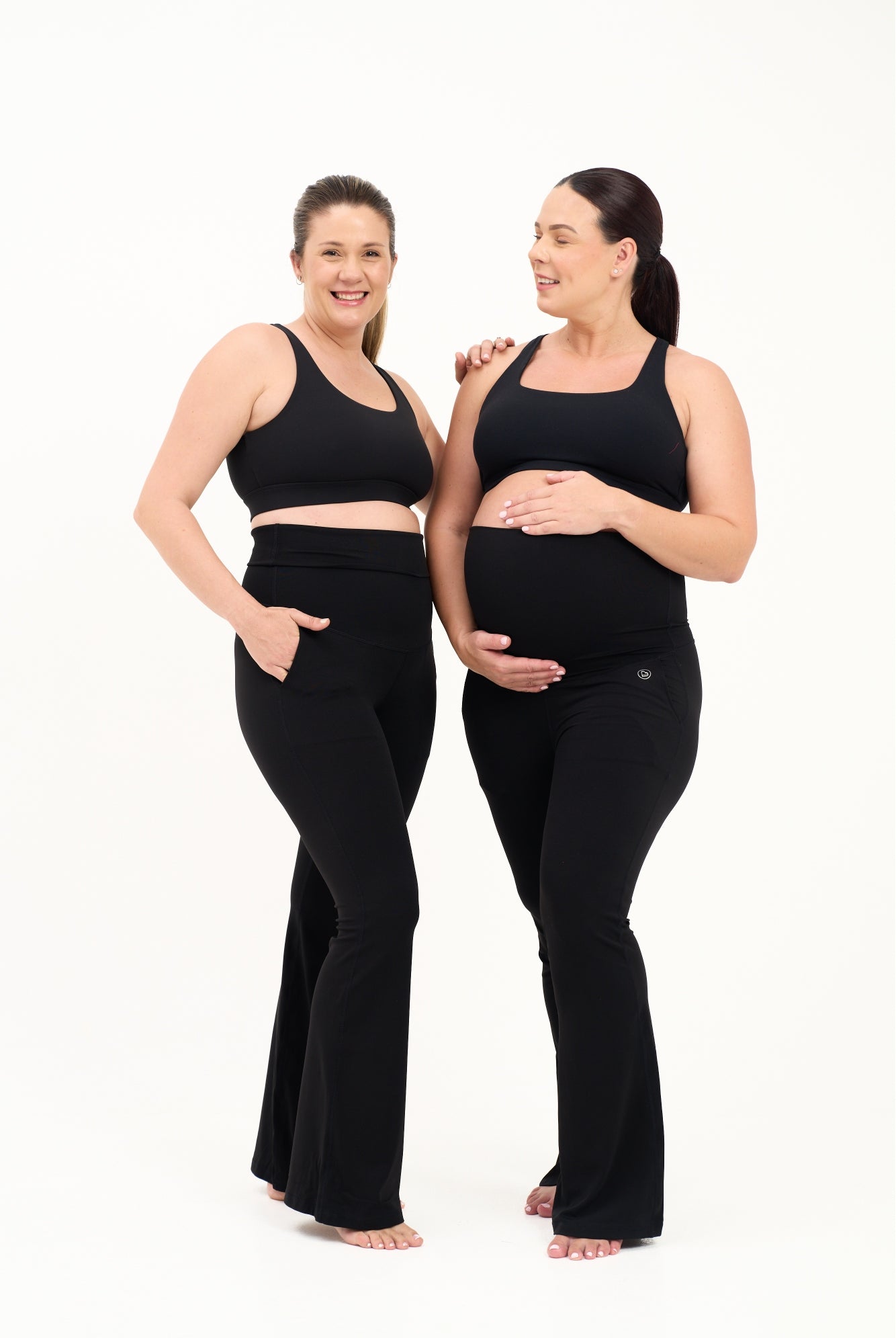 Mum wearing flared maternity leggings in black