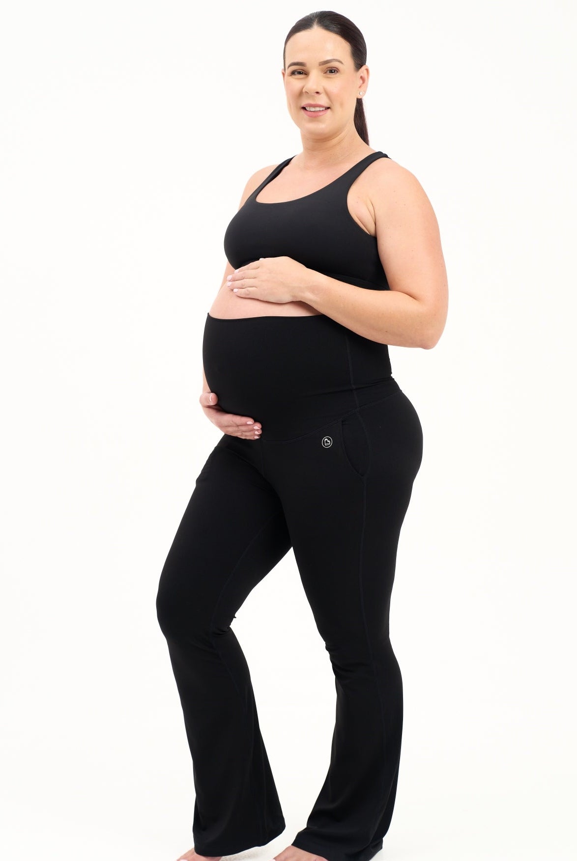 Mum wearing flared maternity leggings in black