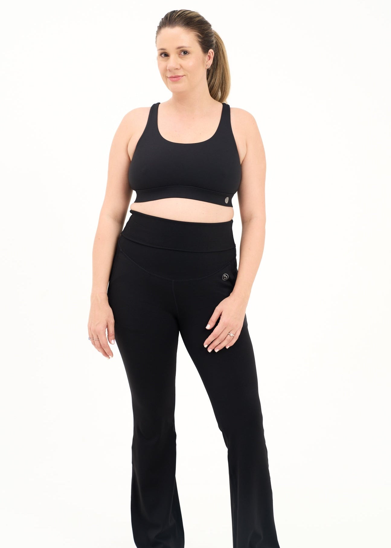 Mum wearing flared maternity leggings in black