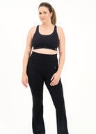 Mum wearing flared maternity leggings in black