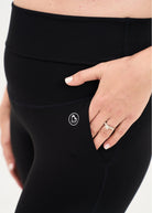 Mum wearing flared maternity leggings in black