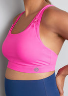 Nursing sports bra, hot pink, side view on model
