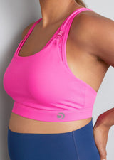Nursing sports bra, hot pink, side view on model